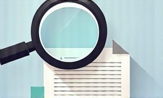 Magnifying glass over documents